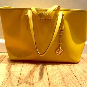 Michael Korda yellow laptop carrier bag.